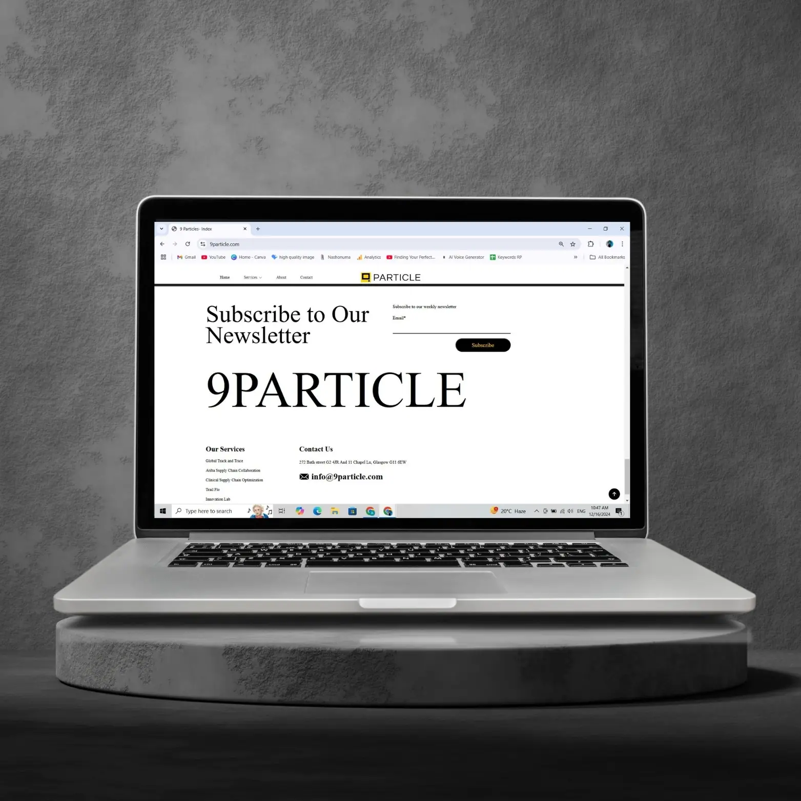 9Particle newsletter sign-up and bold wordmark footer shown on a laptop